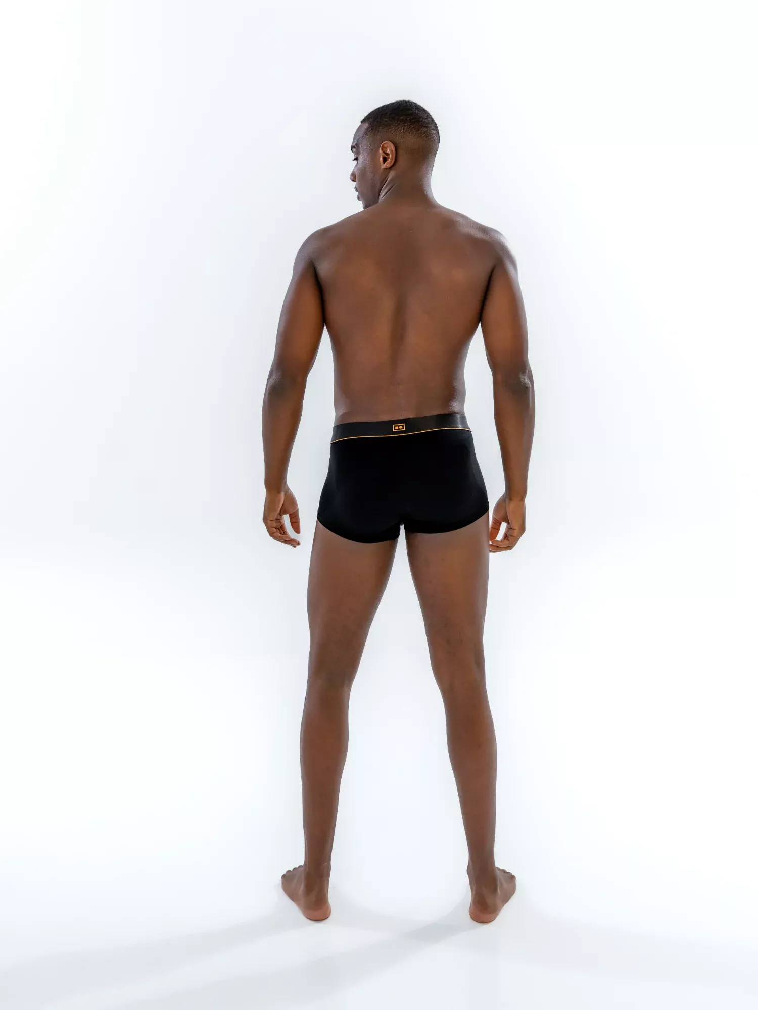 Model wearing the 1" Classic Trunk in black, back view