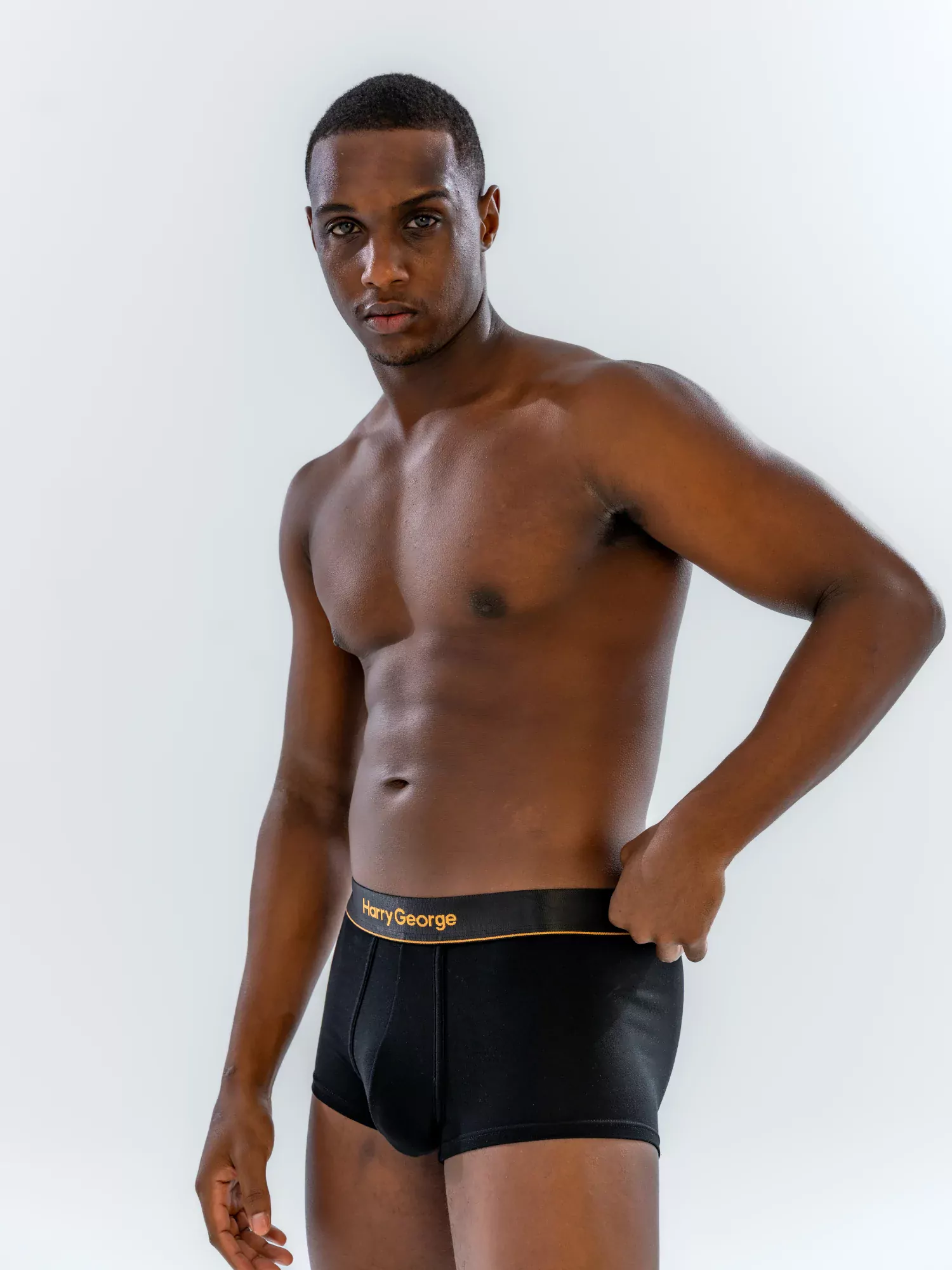 Model wearing the 1" Classic Trunk in black, three-quarter view