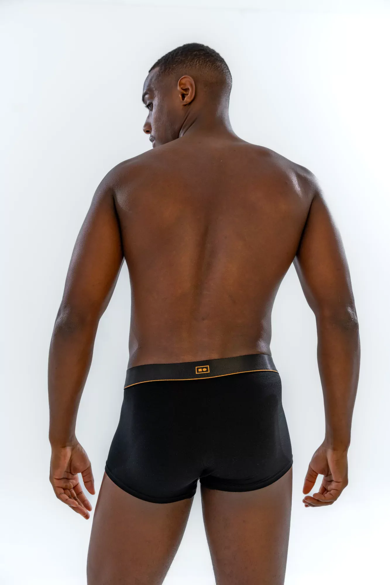 Model wearing the 1" Classic Trunk in black, back view