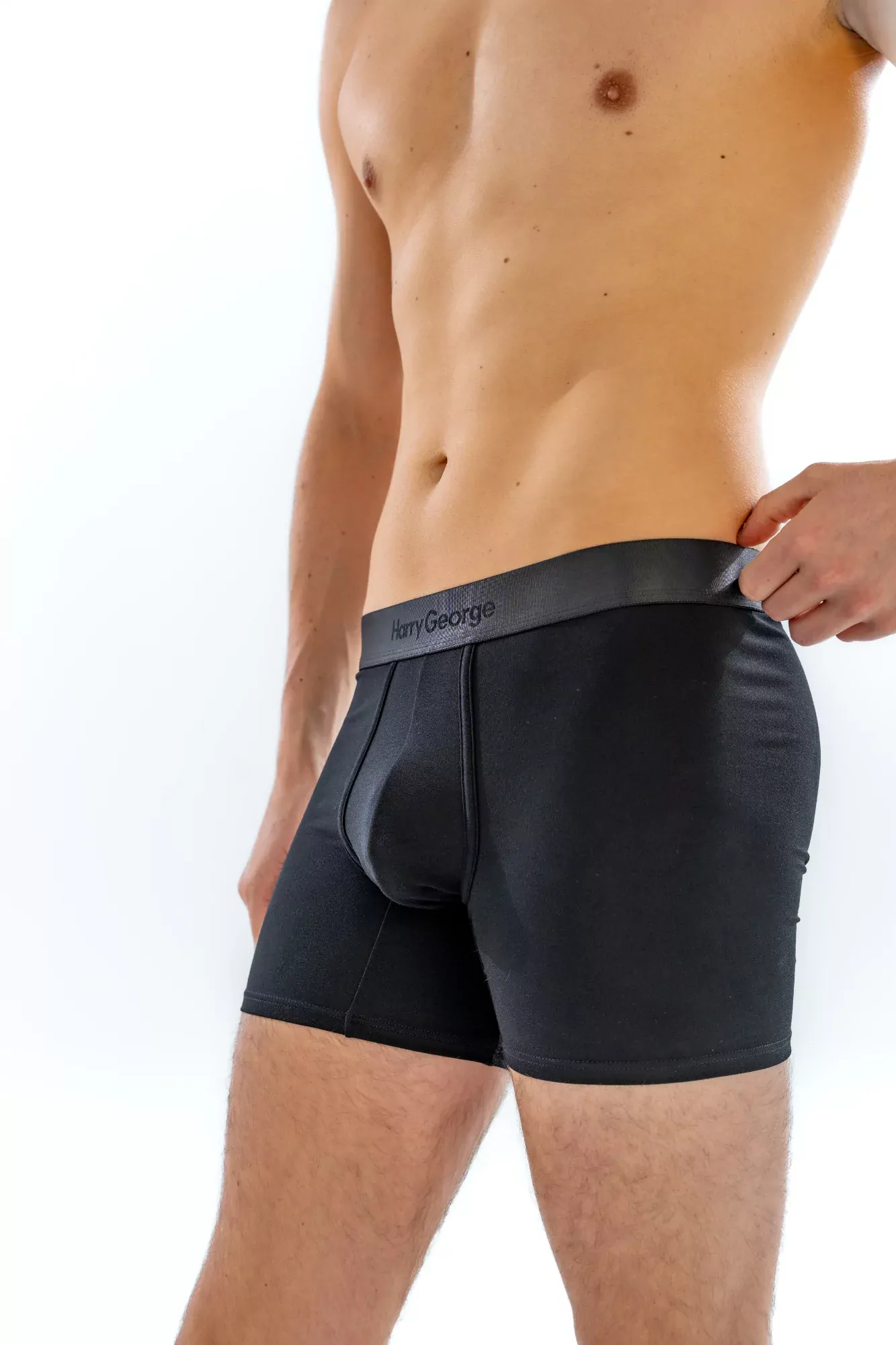 Close-up of the 4" Tonal Boxer Brief in black on a model, front view
