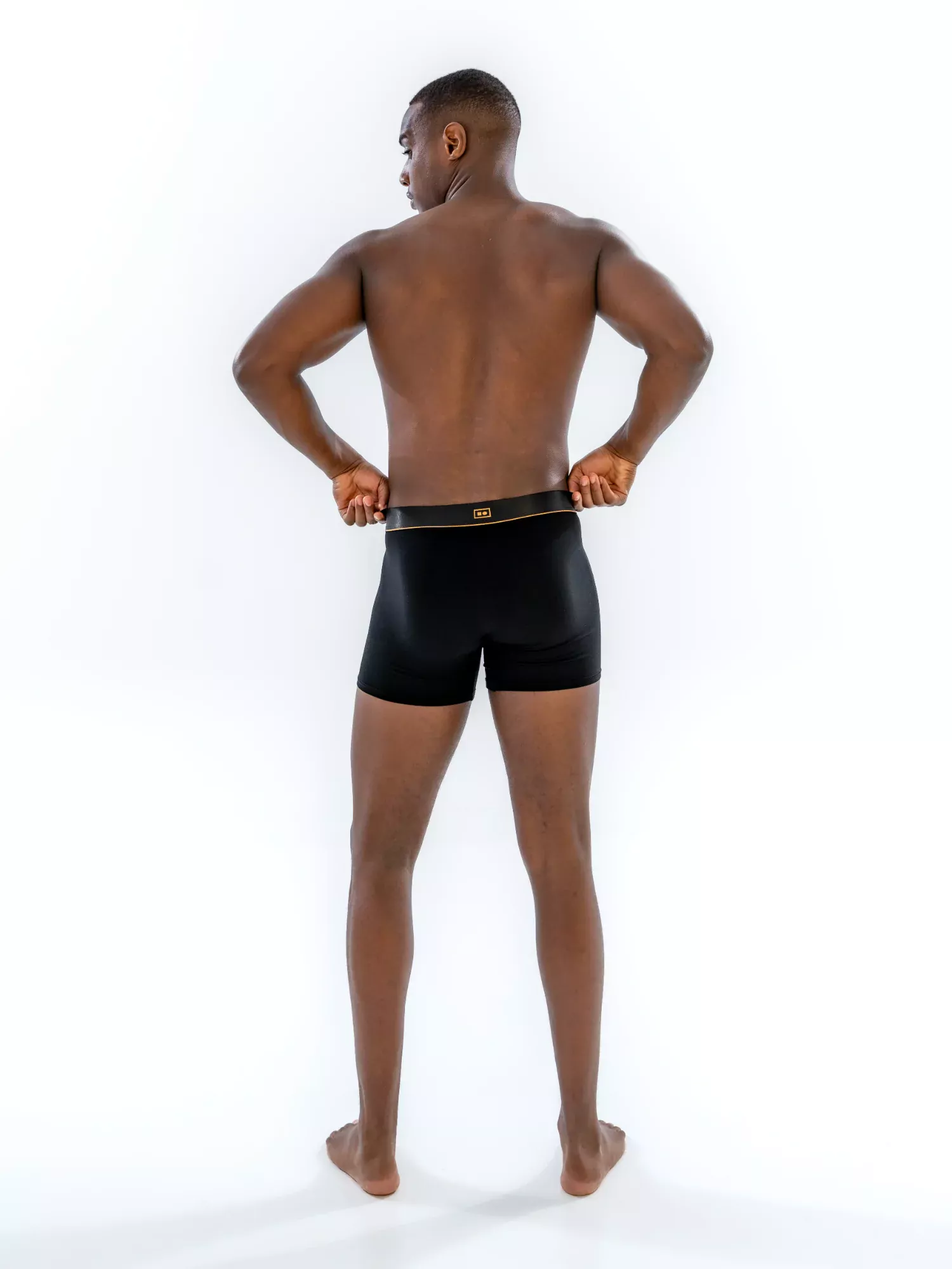 Model wearing the 4" Classic Boxer Brief in black, back view