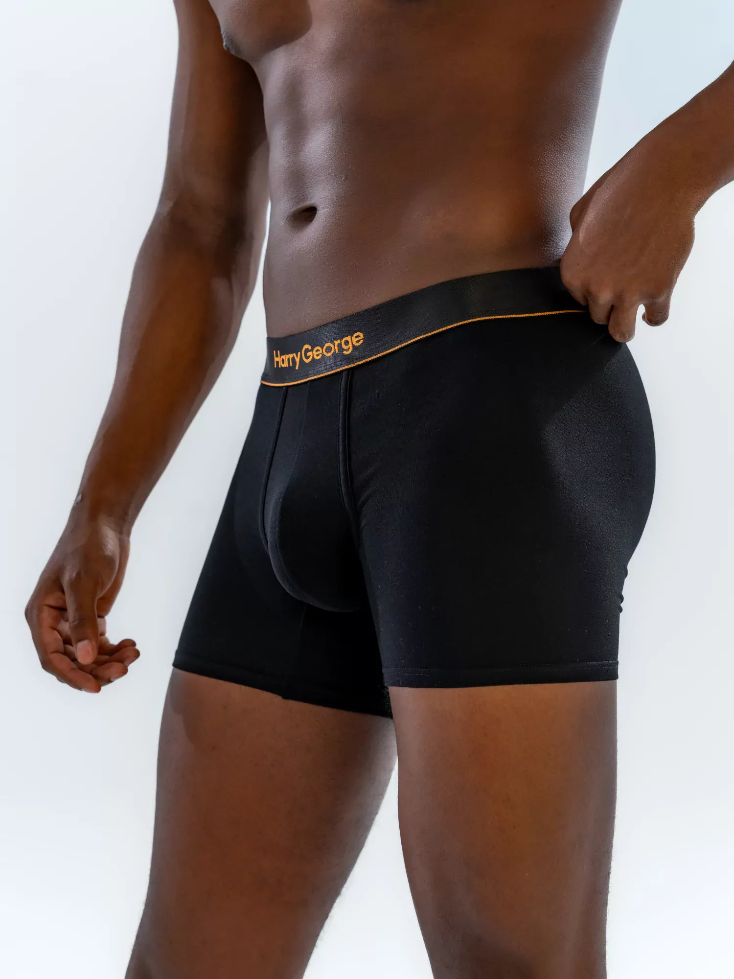 Close-up of the 4" Classic Boxer Brief in black on a model, three-quarter view