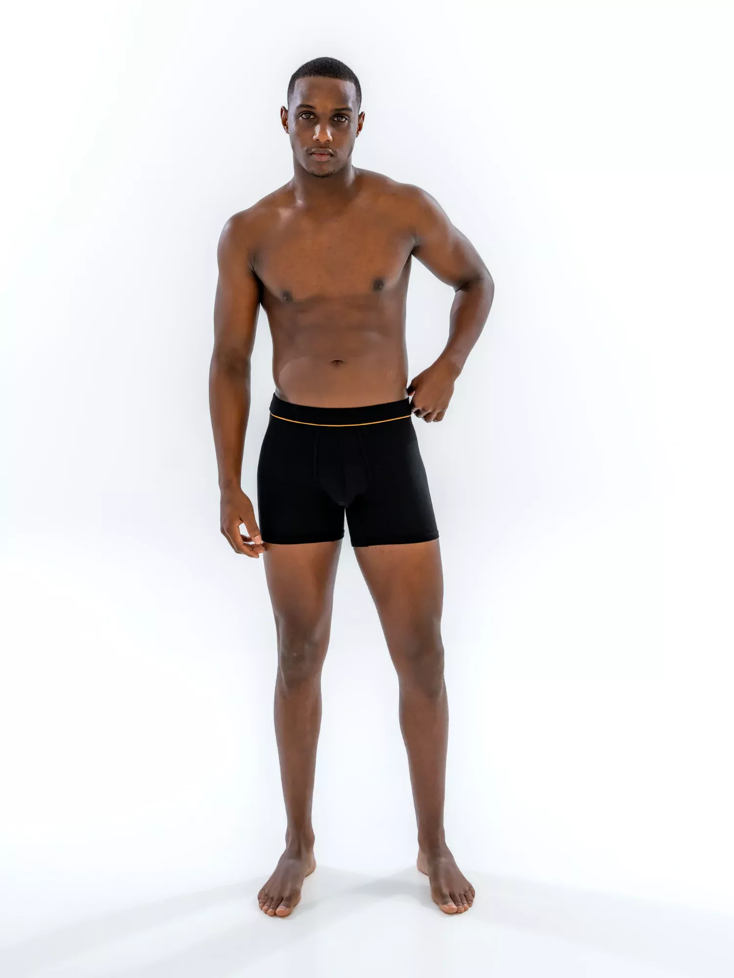 Model wearing the 4" Fabric-Wrapped Boxer Brief in black, front view