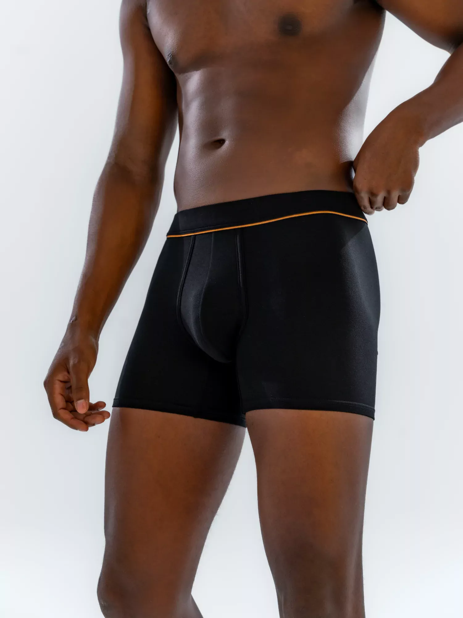 Close-up of the 4" Fabric-Wrapped Boxer Brief in black on a model, front view