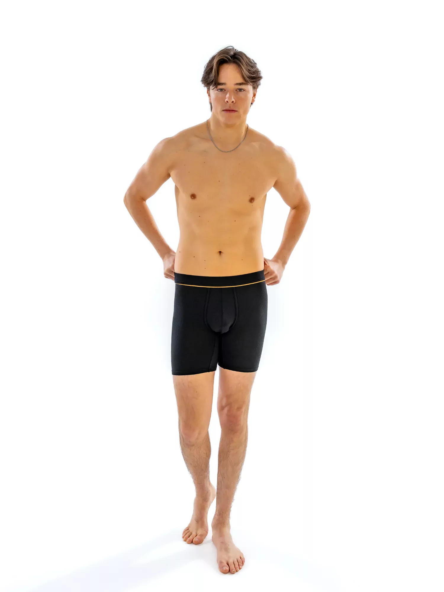 Model wearing the 6" Fabric-Wrapped Boxer Brief in black, front view