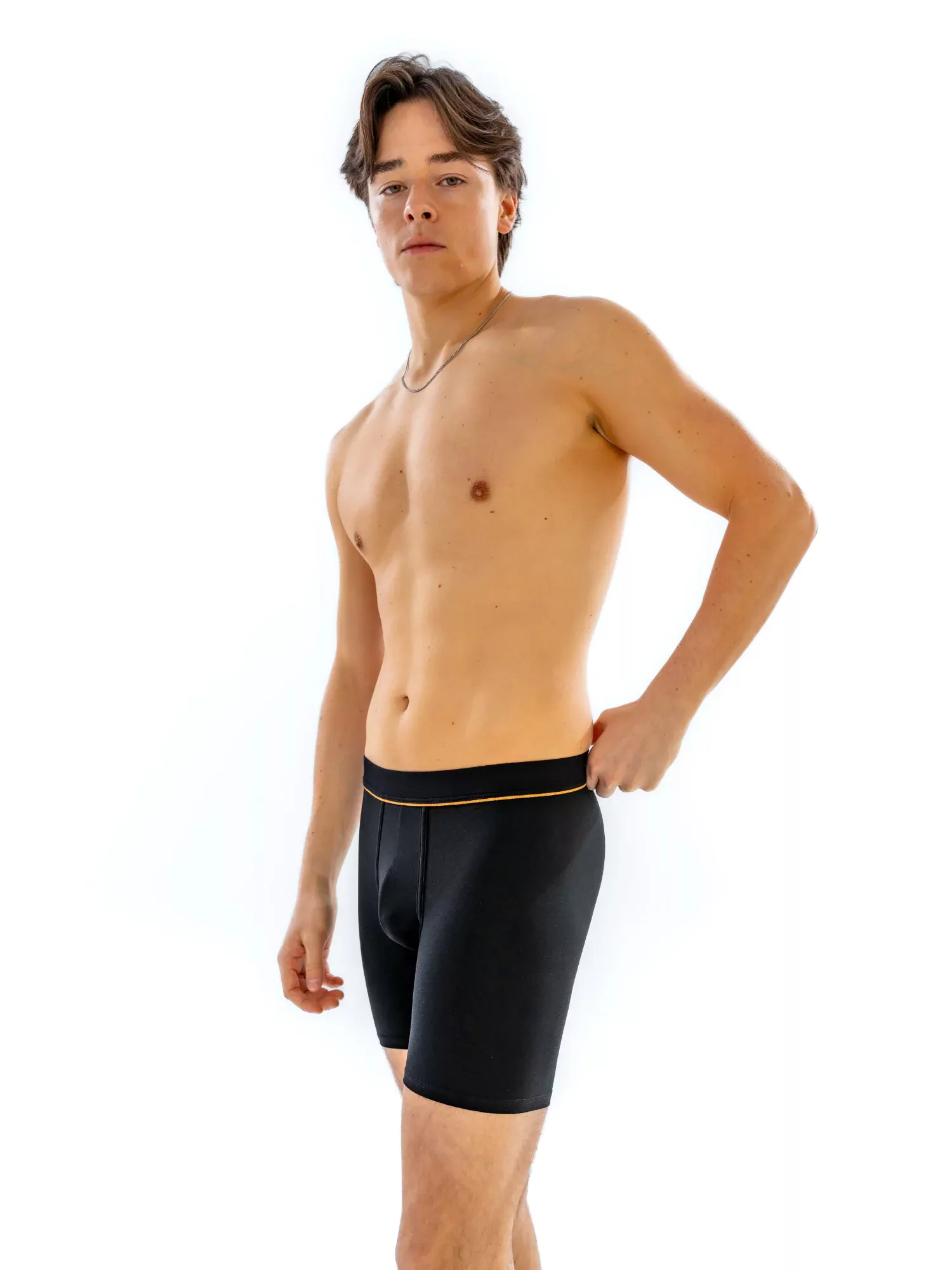 Model wearing the 6" Fabric-Wrapped Boxer Brief in black, side view