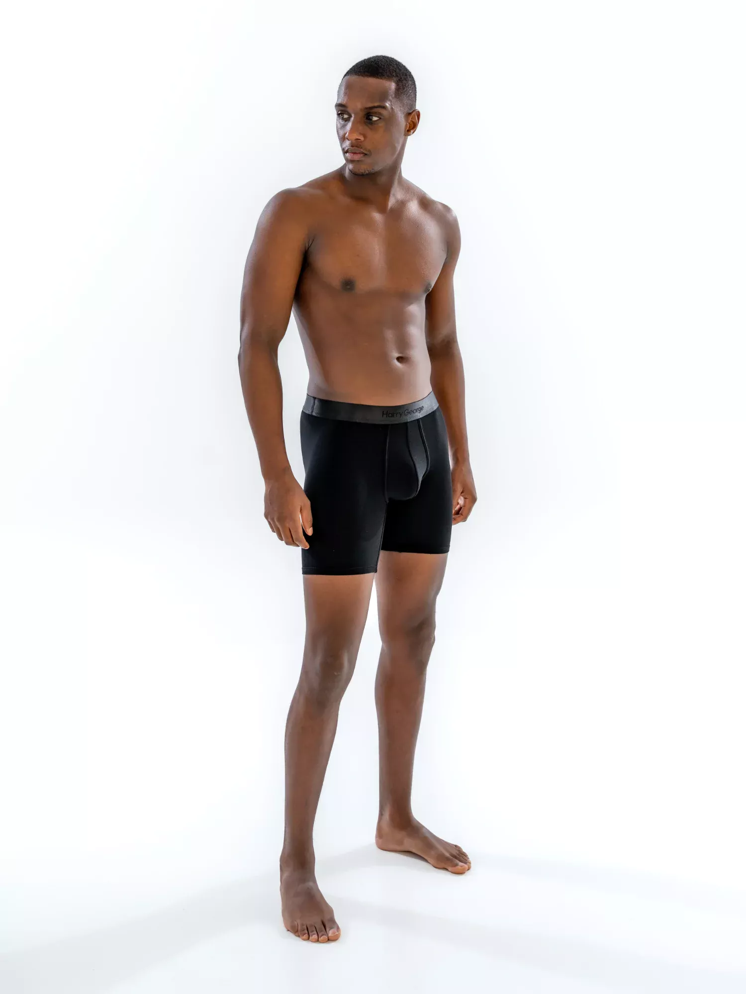 Model wearing the 6" Tonal Boxer Brief in black, front view